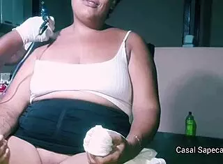 Crazy Sapeca gets tattoo without panties, teasing tattoo artist with full exposure.