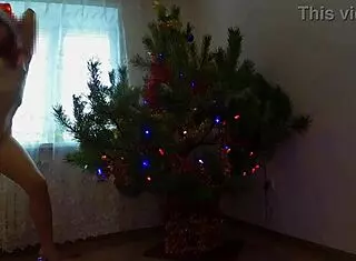 Bitch dancing around the christmas tree, then solo pussy play.