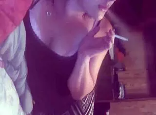 She blows while smoking