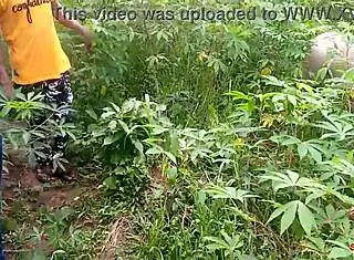 King's ebony maid gets fucked by two guys outdoors on the cassava farm