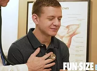 Older doctor examines nervous young patient