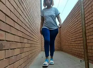 This ebony girl flashes her big natural tits and ass outside