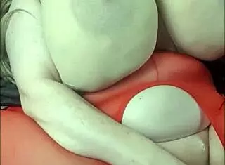 i'm the lady with huge tits layin on back playin with bbc toy.