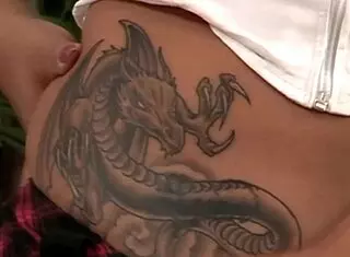 This exotic tattooed model strips and gives blowjob, looking so sexy with clothes off