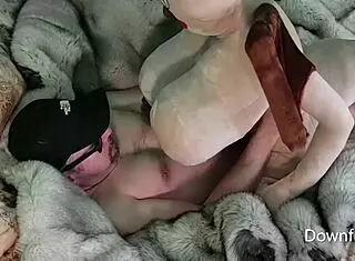 Cowgirl action with plush Bat Girl sex doll on blue fox fur. What a ride!