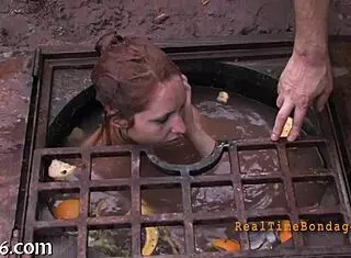 She's bound and gagged, getting punished hard! 😈