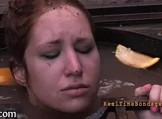 She's bound and gagged, getting punished hard! 😈