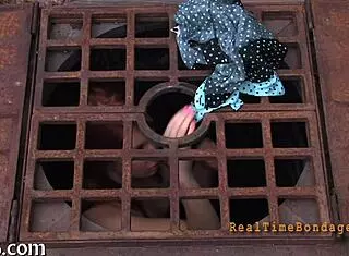 She's bound and gagged, getting punished hard! 😈