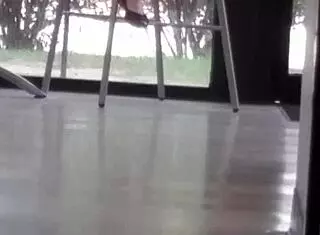 Mature woman playfully engages with shoes