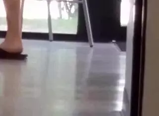 Mature woman playfully engages with shoes