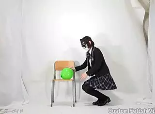 Girl casually plays with colorful balloons