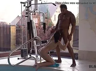 svelte girl rides muscular coach in interracial pool sex