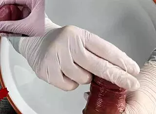 Patient POV: White latex gloves give close-up handjob on glans in medical water features
