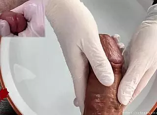 Patient POV: White latex gloves give close-up handjob on glans in medical water features