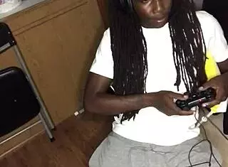 ebony girl gives detailed blowjob to black guy while he's gaming
