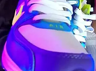 a skinny blonde teen shows off her nike air sneakers in a homemade foot fetish video with her friend