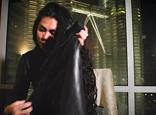 Asian dominatrix performs leather fetish domination.