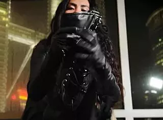 Asian dominatrix performs leather fetish domination.