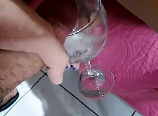 drinking cum from the cup in this bukkake session