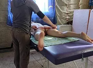 Tattooed redhead gets undressed for massage 😈