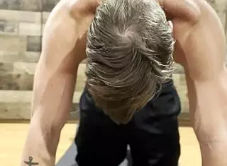 I am stretching my muscular bodybuilder form