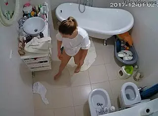 Smart amateurs engage in shaved masturbation under voyeur watch