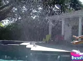 I see this bikini brunette getting wet outdoors, and she wants you too