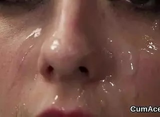 beautiful girl swallows cumshot on her face