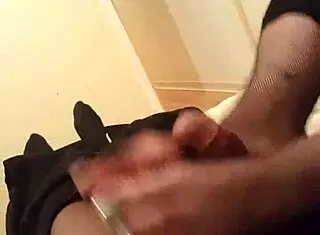 Miss K gives an amazing footjob in fishnets