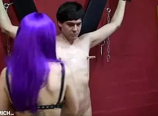 Torment of a slave on the St. Andrew's cross by mistress in leggings and hot boots with clamps