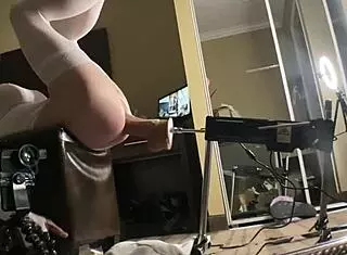 Shemale in tight bodysuit drilled by big thick dildo.