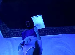 Teen Gigi Breeze enjoys blacklight massage sensually