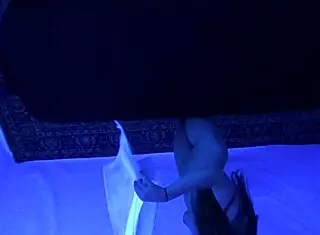 Teen Gigi Breeze enjoys blacklight massage sensually