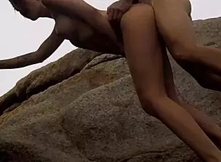 Redhead teen has sex on rocks with stranger's big cock