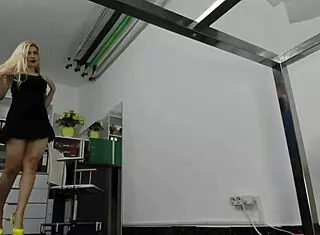 blonde milf performs striptease on office chair at work