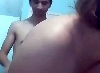 Webcam couple touches tits, bends over doggystyle