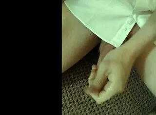 Guy in White Shirt Wanks Furiously, Hand Moving Up and Down His Hard Cock Beneath the Fabric!