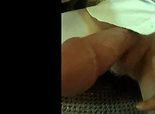 Guy in White Shirt Wanks Furiously, Hand Moving Up and Down His Hard Cock Beneath the Fabric!