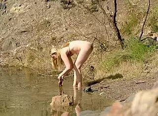 Blonde Charlie pleasures herself by Blue Lake in Victoria. What a wild outdoor show!