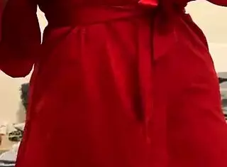 brunette in red lingerie touching her big tits