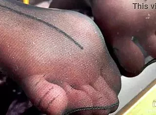 goddess teases with her cute feet and toes in black pantyhose, close up fetish