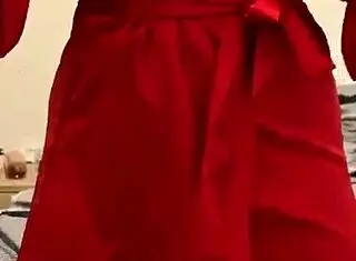 brunette in red lingerie touching her big tits