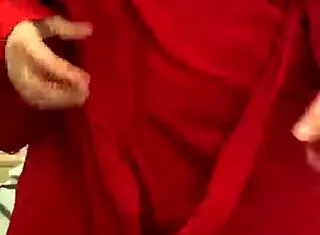 brunette in red lingerie touching her big tits