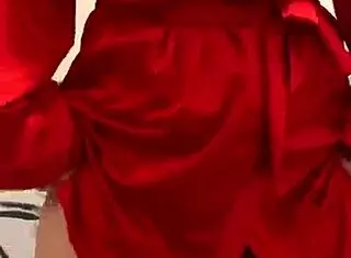 brunette in red lingerie touching her big tits