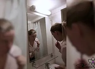 Blonde amateur gets horny and fingers her pussy while showering