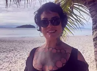 Bold shibari bondage exposes small tits in public outdoor setting