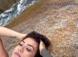 Bold shibari bondage exposes small tits in public outdoor setting