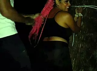 He says, Take it in the ass, as he fucks her tied in the forest.