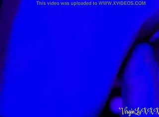 Teen dances sensually in night club with partner.