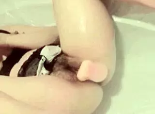 asian girl masturbates in bathroom with toy